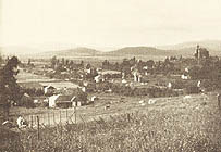 Now it is 1905, and the setting sun illuminates the quiet little community, the High School is at the far right.