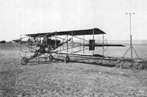 W.A. Davis sits comfortably in this eight cylinder biplane